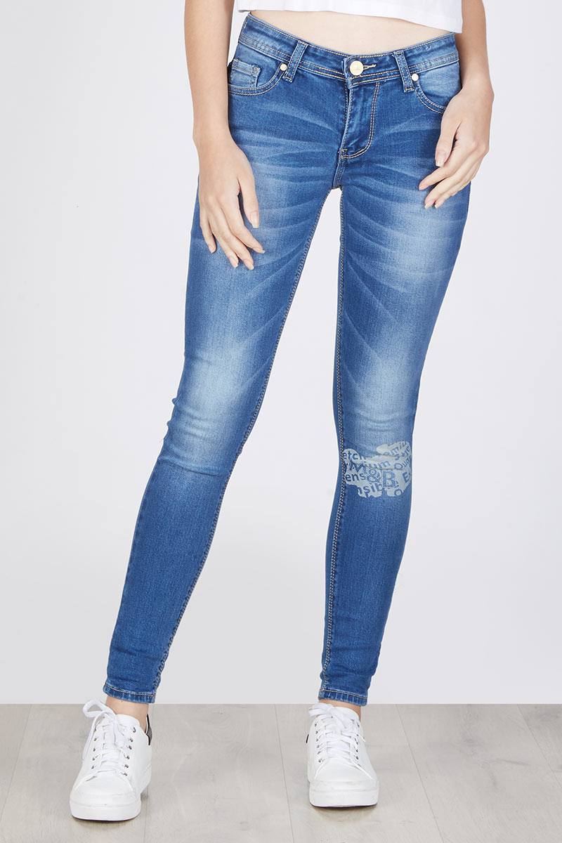SLIM FIT DENIM FEATURING LASER FONTS AND FUN COLOR STRIPE ON ANKLE